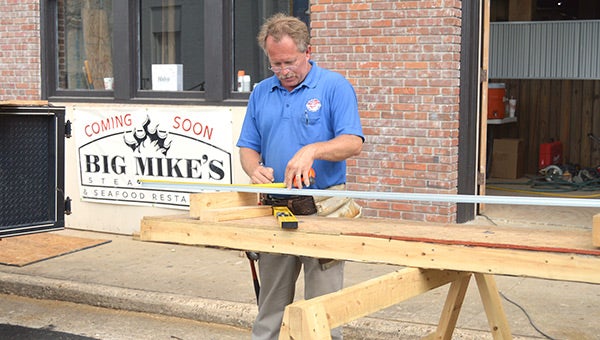 Andalusia Building Inspector Richard Moore works Monday at the future home of Big Mike’s Steakhouse. The City of Andalusia is acting as general contractor for the renovations on the Andala building, which it owns, and will lease it to the restaurant. 