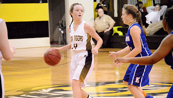 Maggie Wilkerson sets up a play for the Lady Tigers. Josh Dutton/Star-News