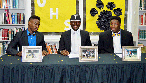 Opp seniors Hennis Washington, Orlando Lacey and Tree Lane all signed a letter of intent during Wednesday’s National Signing Day.                                 Josh Dutton/Star-News